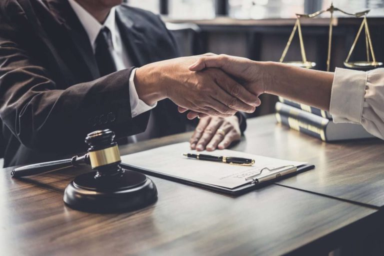 Attorney shaking hands with a business client